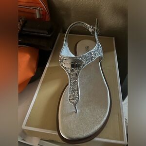 MK brand new in size 8 silver with glitter.